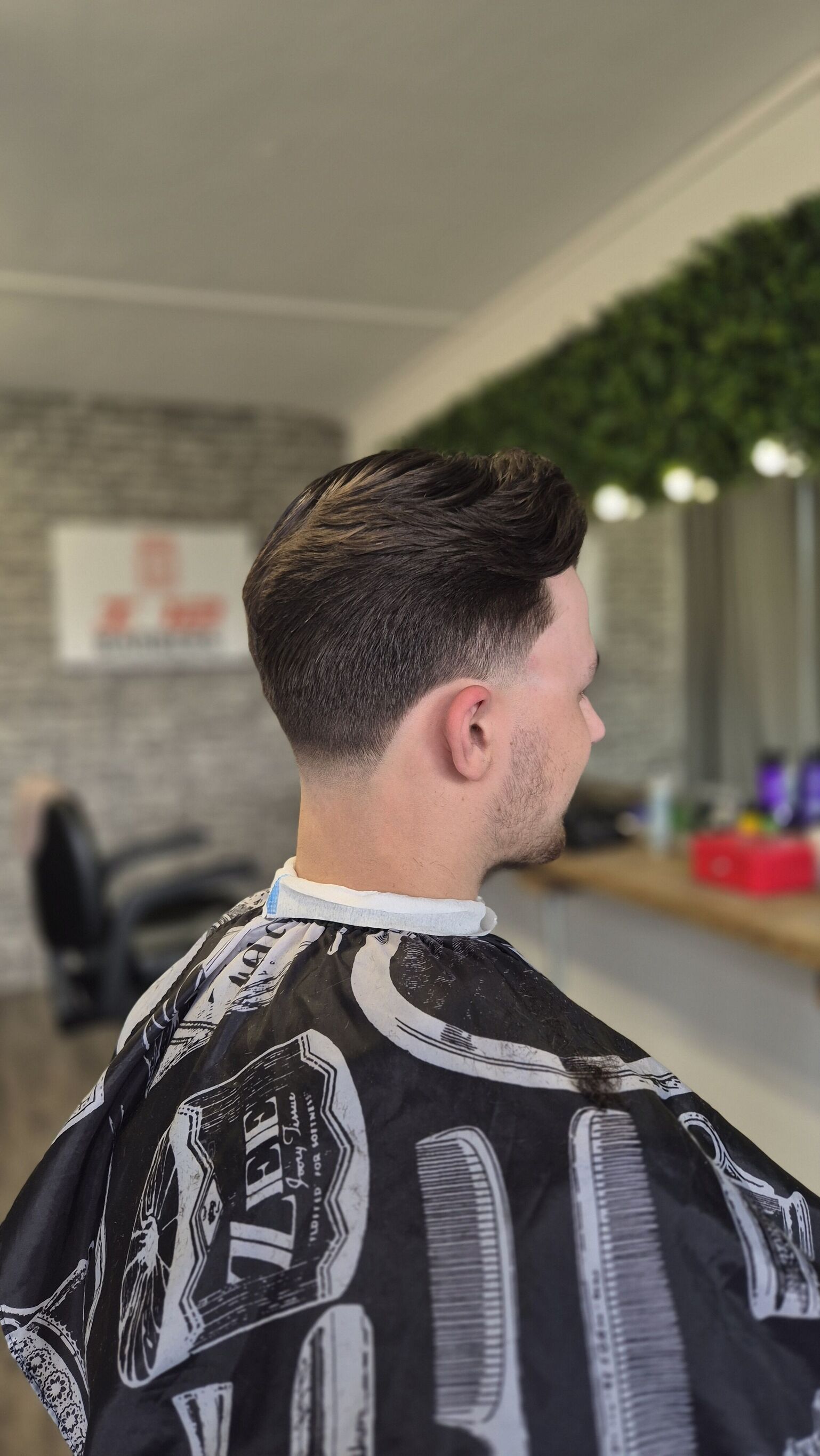 Side profile in the shop, the i12 sign behind