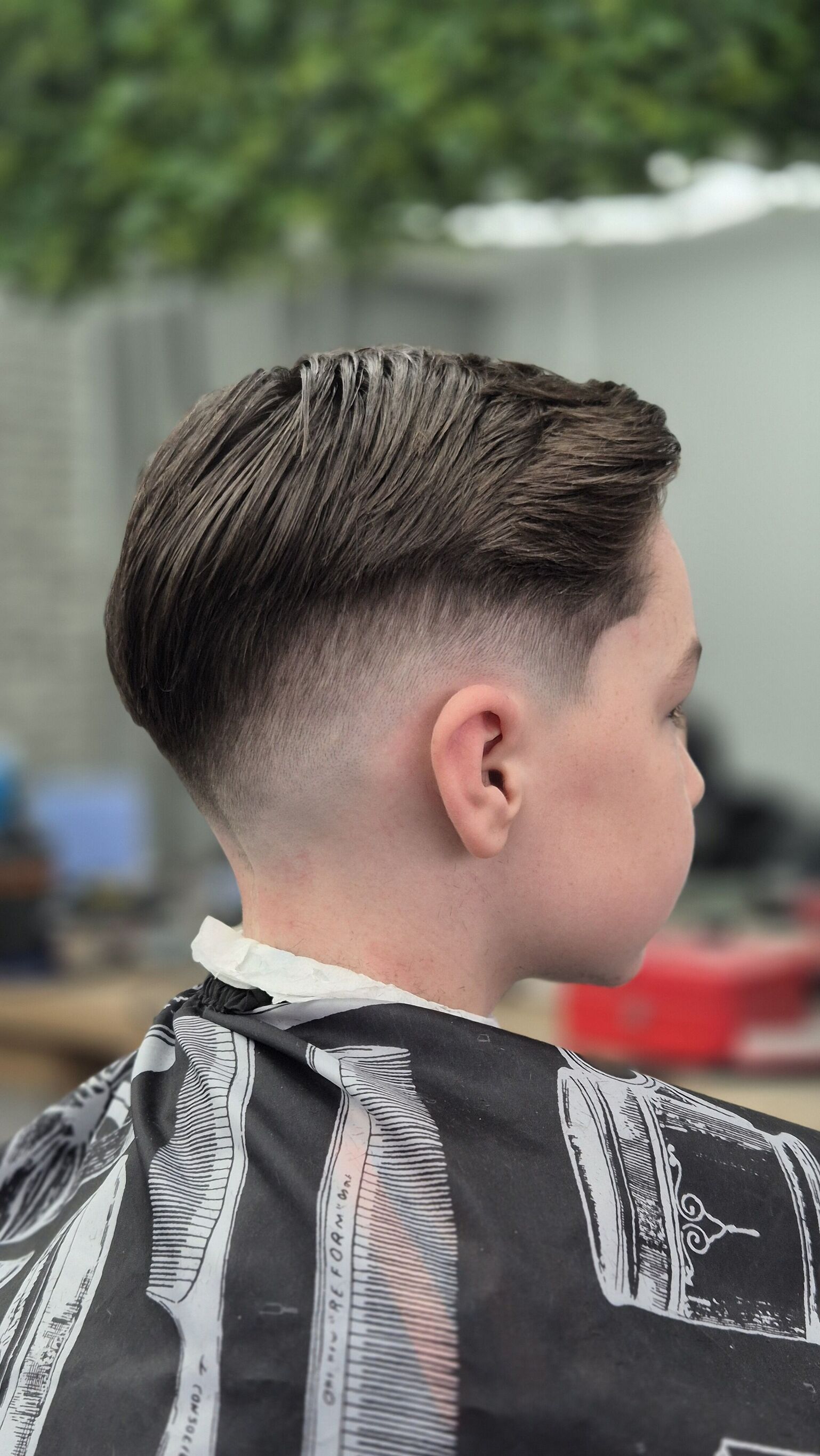 Swept back top with a fade at the sides